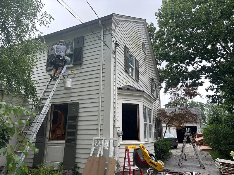 Andersen windows being installed in a New Haven, CT colonial home